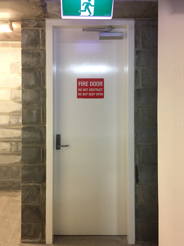 Fire-rated doors — New frame and fire door with signage